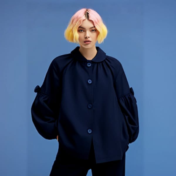 Face-swapped photo of a woman with pink and yellow hair in black shirt and black pants, posing for the camera.