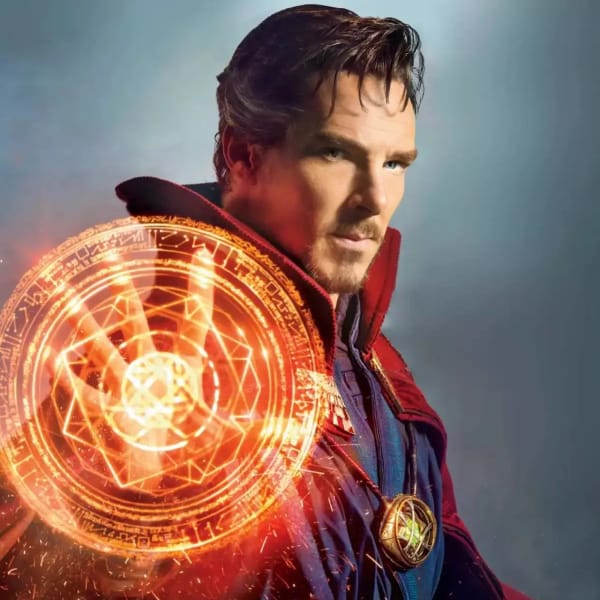 Doctor Strange stands with a glowing orange magical mandala spell circle emanating from his hand, wearing his iconic red and blue sorcerer cloak.