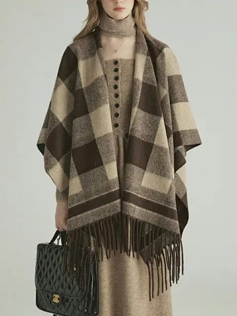Una mujer con un poncho a cuadros y una falda larga de color beige, con un bolso negro, modelo para el intercambio de ropa de AI.