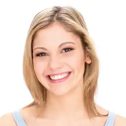 This is a young blonde girl on the facial expression changer, and she is laughing.