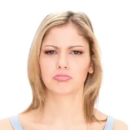 This is a young blonde girl of the ai facial expression changer, and she is sad.