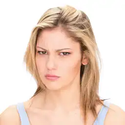This is a young blonde girl of the ai face expression changer, and she is angry.