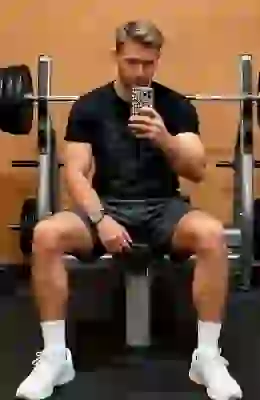 Athletic man in gym transformed into professional fitness photo with AI