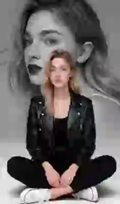 AI-generated double-exposure portrait of a blonde woman in a black leather jacket, black top, black pants, and white low-top canvas shoes, sitting on the ground, with a black-and-white close-up of her in the background. Template for an image-to-image tool.