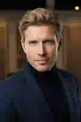 Portrait of a handsome blonde middle-aged western man in dark blue suit. Template for AI image to image.