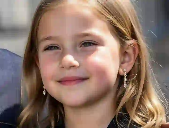 Portrait of Scarlet Johanson with a baby-face filter, smiling at the camera with chubby cheeks, smooth skin, and natural pink blush. Used as a template for AI baby filter.