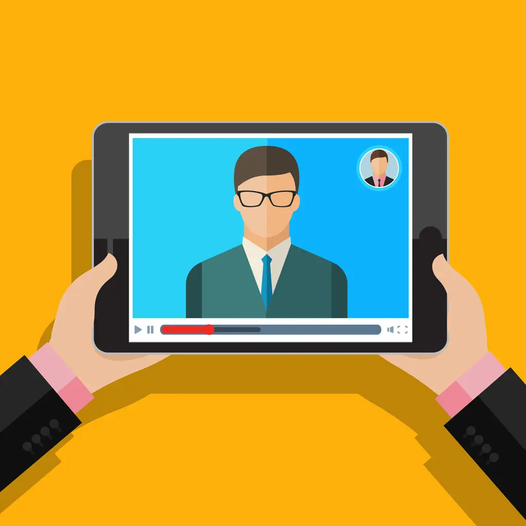 Bir kişi bir tablette video izliyor, takım elbiseli bir erkeği ve gözlükleri gösteriyor.